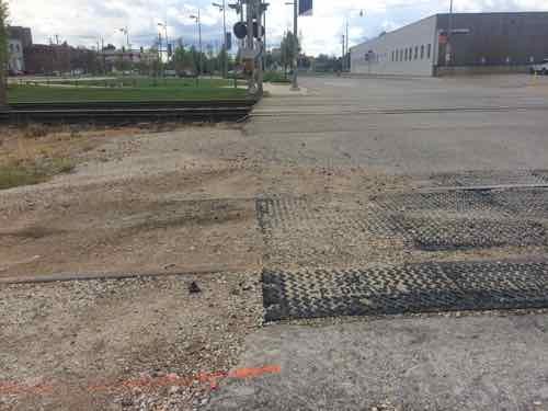 Looking back South after having crossed the two MetroLink tracks and a third extra track (nearest)