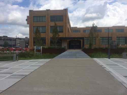 Back in the Commons we can approach the @4240 building after crossing the rain garden on the metal grate pedestrian bridge -- love this!