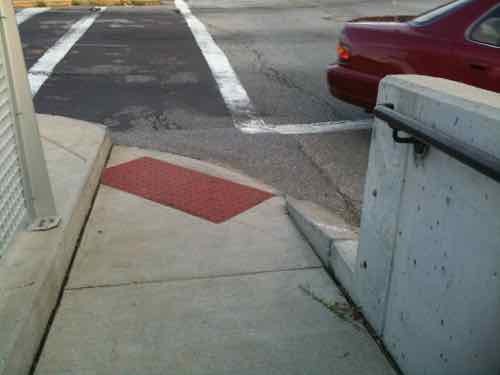 Before: we had to use a narrow ramp reach the crosswalks. If you're waiting to cross a street someone crossing the other would be blocked.