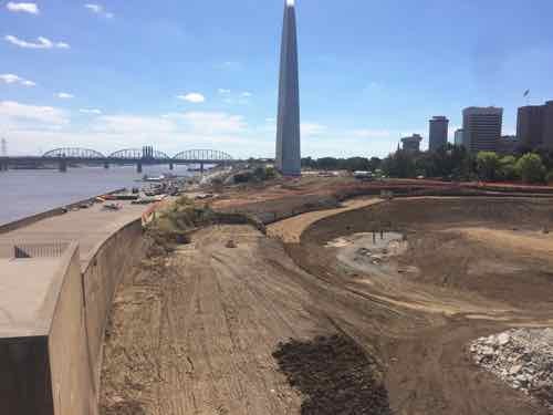 The wall conceals the train tracks, part of the historic landscape design . 