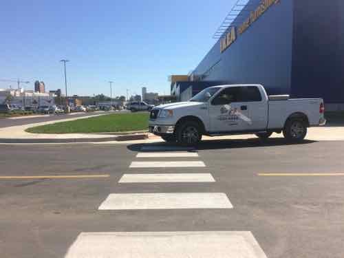 Looking East toward the store, a construction truck is blocking the view & crosswalk, but they were trying to finish up.