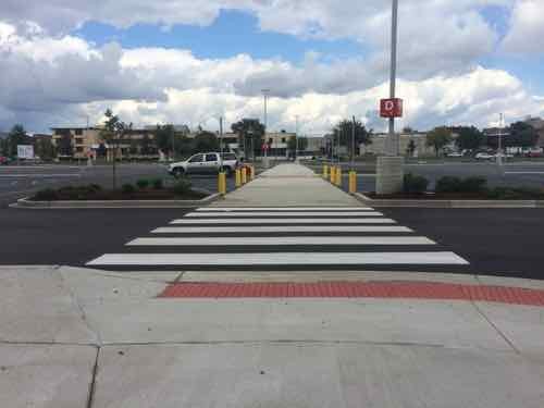 In front of the entry looking North. Pedestrians have two ADA-compliant options for getting through the front parking lot. Every big box store needs to do this! 