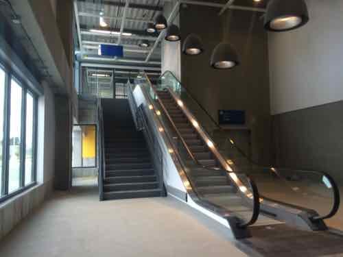 Upon entering from the surface parking or parking love; below the store you'll see stairs, escalator, and elevator on the East end. All these lead you up to the 2nd floor. 