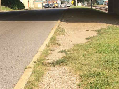 The ground was also worn East of the stop. 