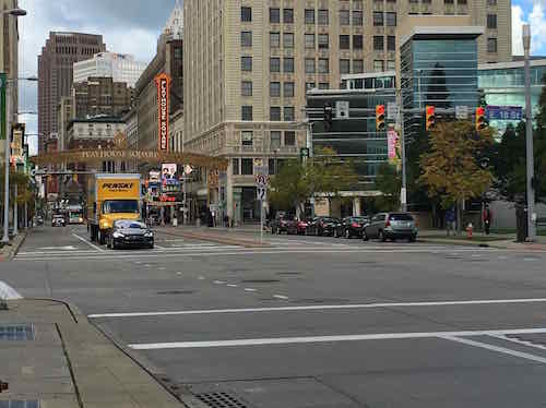 The car & truck are in a left turn lane. To their right is a lane for vehicles continuing Eastbound on Euclid Ave., to their left is a bus-only lane. 