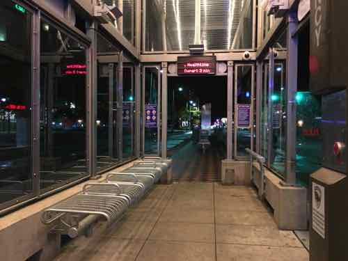 The small stations are open on both ends, an opening on one or both sides for the bus. The other bus doors open onto platform, not in the shelter. 