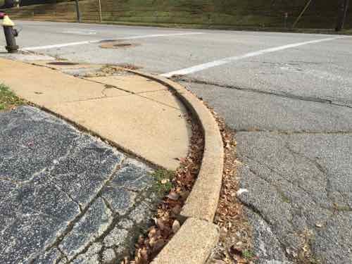 So I returned to the driveway off Wise and rode back toward Macklind in the street. But I can't get onto the sidewalk. I had to choice but to use Macklind Ave -- going into a drive and to go around parked cars until I reached a curb ramp or driveway.