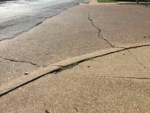 The next point was the street I needed, Highland Park Drive. No curb ramps here either, but I was able to get over this curb. Others might not be able to. 