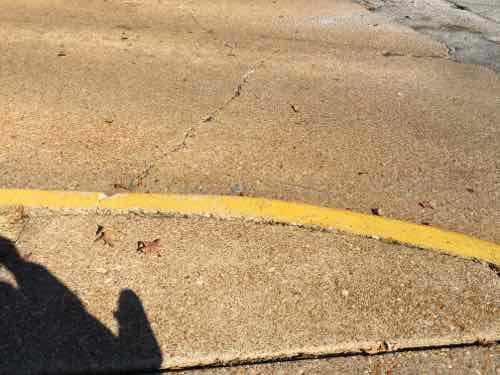 After my appointment I headed North to Oakland Ave, at St. Louis Community College I encountered another curb. I used a nearby drive to once again go onto Macklind Ave to get around the lack of a curb cut. Whoever painted it yellow probably didn't think about wheelchair access. 