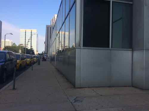 Looking West along the narrow Chestnut sidewalk, the interior floor level is higher than the sidewalk, July 2015