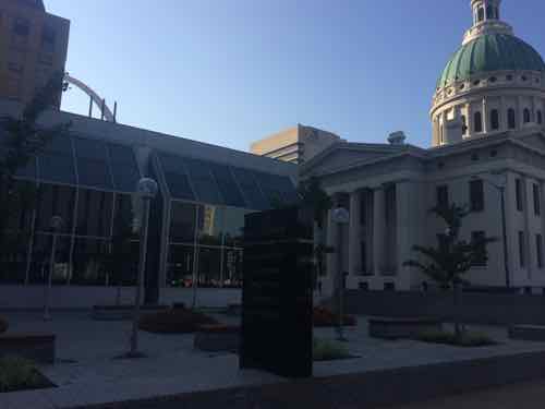 Turning toward the building we can see the top of the Arch peaking above the 1-story atrium space, July 2015