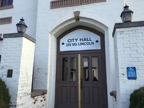 Close up of entry. The address shown is the current city hall. 