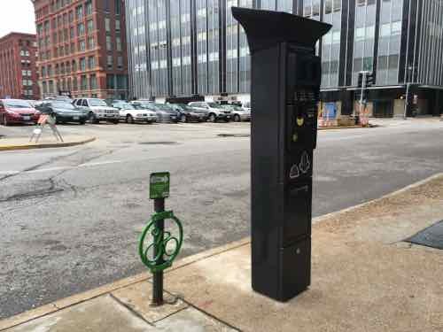 A few days later the old meters were gone, the new pay stations unwrapped. Locking a bike here may be a challenge given the proximity to the new pay station.