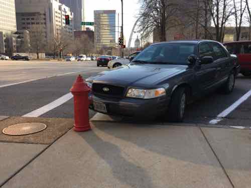 Ford has a spotlight but regular Missouri plates. Click image to view the non-space on Google Street View