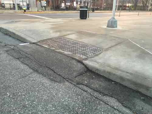 An aside -- the unmarked crosswalk leads to a non-compliant curb ramp that I pointed out prior to completion of the library. 