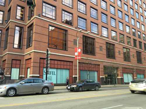 Between Broadway (5th) and 6th the Stifel financial headquarters keeps their ground floor blinds shut.