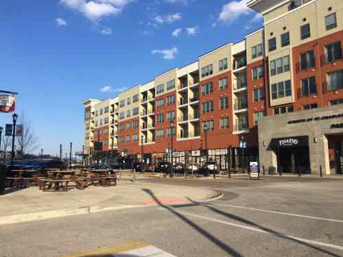 Beale Street has multi-story buildings on both sides with street-level retail storefronts 