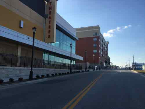 The AMC theater is strikingly modern compared to the other buildings
