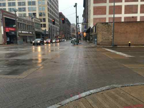 Crossing 14th at Washington Ave the decorative brick crosswalk isn't as visible as the bright white continental design 