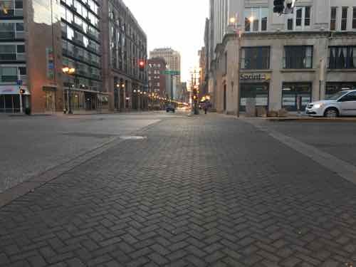 At Washington & Tucker there isn't a compliant crosswalk marking. Not everyone can distinguish the brick pavers. Someone walking on the far left of the pavers is in the right traffic lane of Washington Ave and would likely get hit.