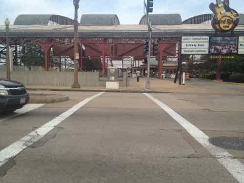 The crosswalk to Union Station led directly to a curb, those of us in wheelchairs had to go outside the crosswalk and use the auto exit, at right -- a clear ADA violation for years, August 2012