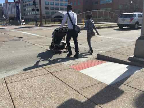 I arrived on the West side just as people pushing a stroller used the ramp to cross 18th 