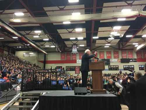 I was inside just before 8am. Mr. Sanders began speaking around 10:30am. I could not have been any closer to the stage!