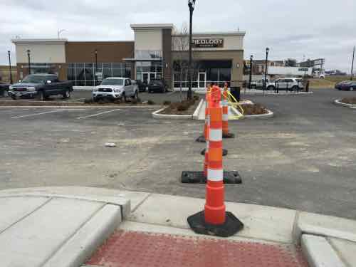 Construction workers to the West managed to put cones in the pedestrian path. I was able to move the first and go around the others