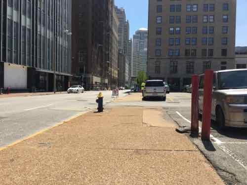 Looking South along 11th you see the difference. The sidewalk in the foreground is owned by someone else, but it narrows at Deutsch's lot across the alley