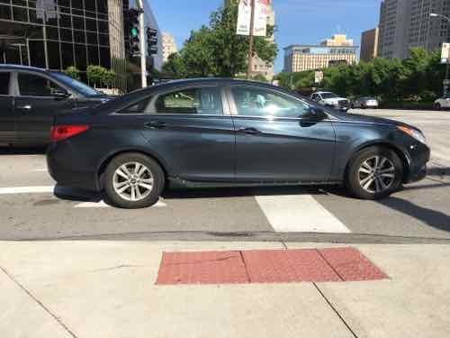 There's a green light but no pedestrian signal, but that's not the main problem