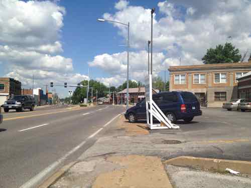 Approaching Florissant Rd in 2012, the little pedestrian space available was invaded by a vehicle parked on the narrow sidewalk