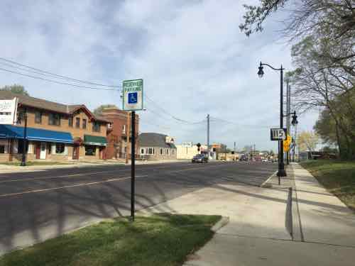 Now the sidewalks are wider and parallel parking exists in this commercial area 