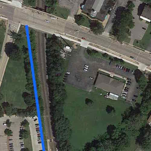 The blue line represents a straight path from station to Natural Bridge. The remaining triangle cam be a pocket p;ark and/or a mixed-use TOD site. Click image to view in Google Maps