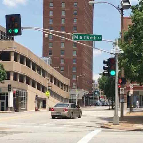 Northbound vehicles get a green light, those turning left onto Westbound Market get a left arrow. But pedestrians on the West side still get a don't walk