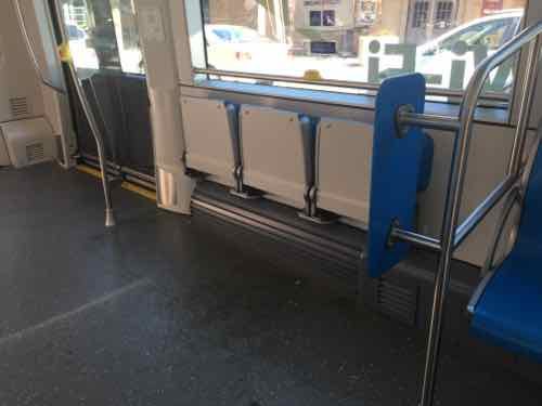 The center car has two areas with theater seats. My wheelchair fit here and my husband could sit on one seat.