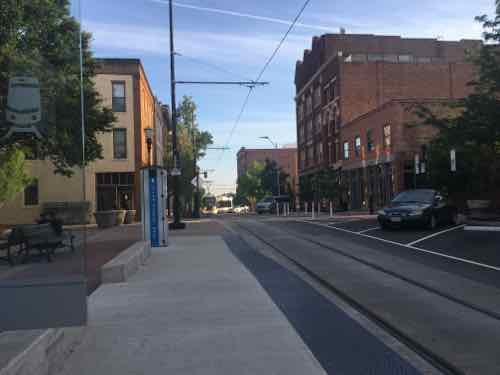 Looking North you can see the streetcar coming around the corner in the background 