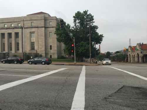 At right a white car waits on 18th St to turn right onto Market St, 6:50am on 5/26/2016