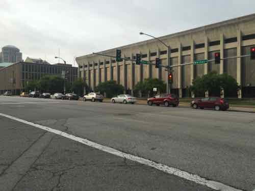 These cars, between 16th-17th, are also waiting. The parking is on the upper level(s) of the addition to the main post office shown in the background 