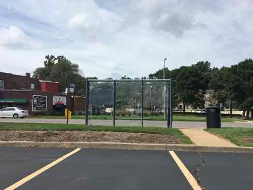 The back side shows a curb prevents access from the parking lot