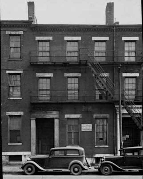 This 1920 photo shows houses on both sides. Source: unknown