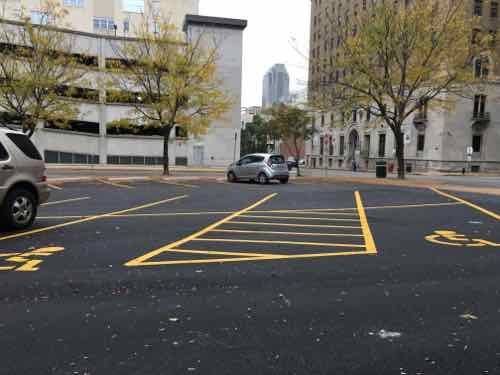 But the other two spaces didn't yet have the required signs three weeks after cars returned to the lot. 