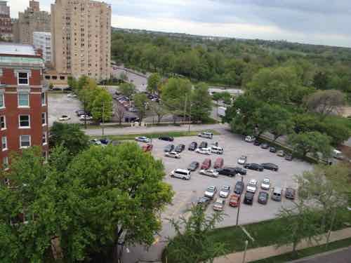 The surface parking in the foreground is for the Chase. Across the alley is the site where the proposed One Hundred is to be built. May 2013 photo 