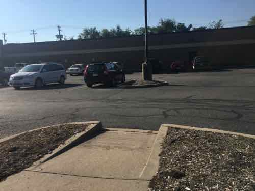 At this point you're dumped into the parking lot where you risk getting hit by cars. The store entry is to the left out of the frame. 