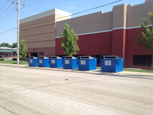 The six recycling bins, oriented to the street, viewed from across Clifton Ave