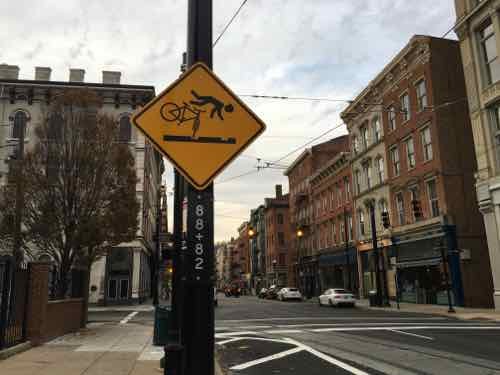 Warning signs are up to alert cyclists to the danger of the tracks. 