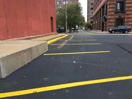 By October 28th the parking stops had been moved forward and the space s were back. 
